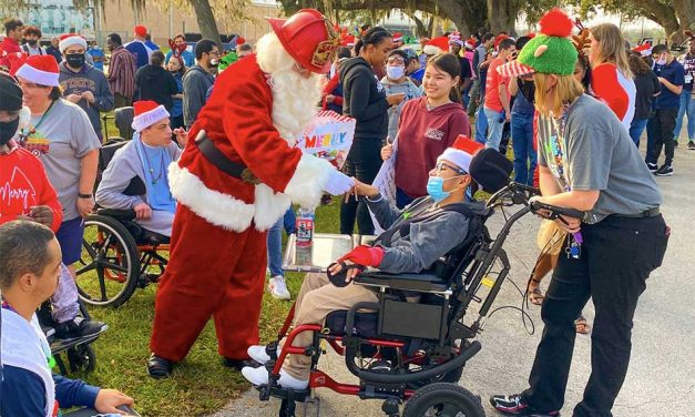 Osceola County Fire Rescue and EMS partners with Santa, visits students at Poinciana High School