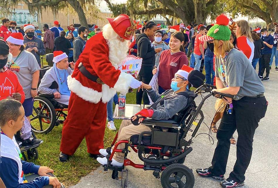 Osceola County Fire Rescue and EMS partners with Santa, visits students at Poinciana High School