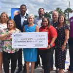 County Commissioner Cheryl Grieb presents $150,000 to Osceola YMCA to restore community pool