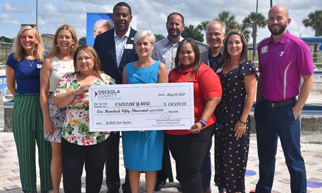County Commissioner Cheryl Grieb presents $150,000 to Osceola YMCA to restore community pool