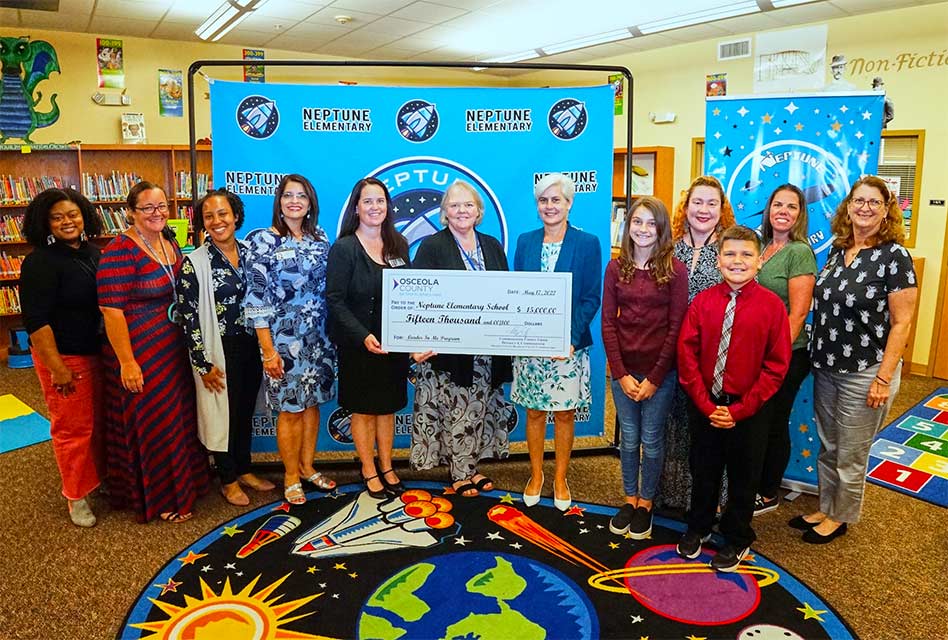 Commissioner Cheryl Grieb presents $15,000 check to Neptune Elementary to support “Leader in Me Program”