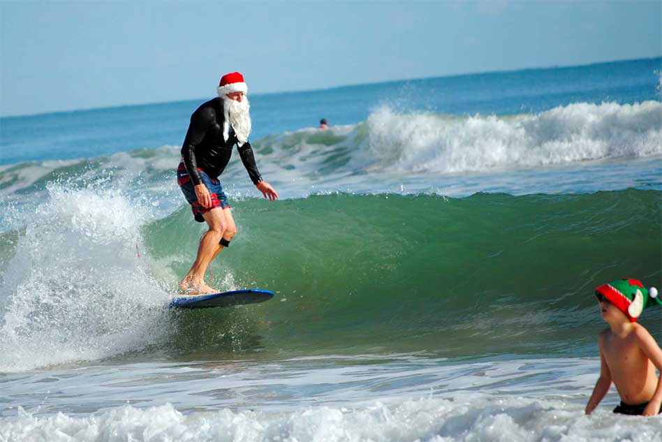 A Coastal Christmas Eve Morning Tradition: The Surfing Santas of Cocoa Beach