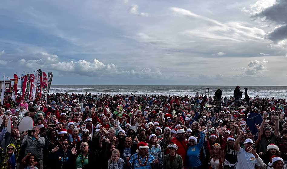 Surf’s Up for Christmas Eve: Cocoa Beach’s 15th Surfing Santas Event Draws Over 10,000 Cheering Fans