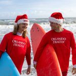 Record-Breaking Turnout for Surfing Santas, Sponsored by Orlando Health, as Thousands Take Over Cocoa Beach