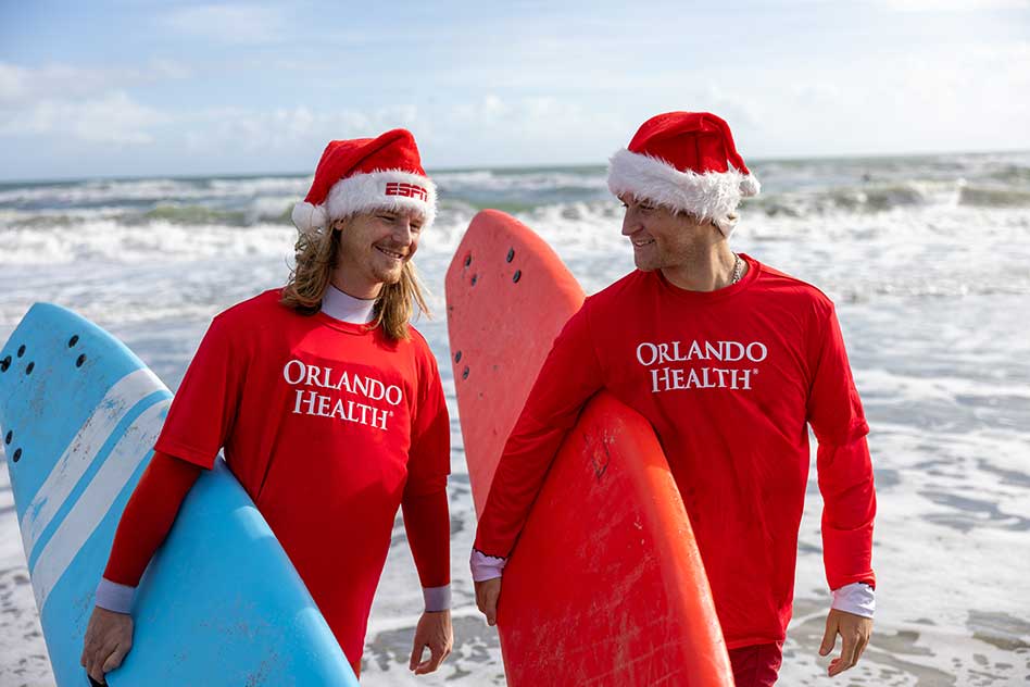 Record-Breaking Turnout for Surfing Santas, Sponsored by Orlando Health, as Thousands Take Over Cocoa Beach
