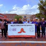Walk a Mile in Her Shoes Event Brings Awareness to Domestic Violence During St. Cloud Monthly Market