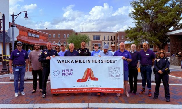 Walk a Mile in Her Shoes Event Brings Awareness to Domestic Violence During St. Cloud Monthly Market