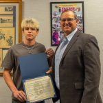 County Commissioner Ricky Booth Honors Harmony Wrestling Standout Nathan Lyttle Following Historic High School Career