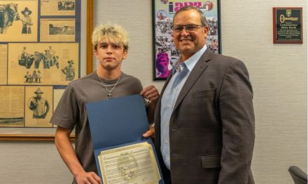 County Commissioner Ricky Booth Honors Harmony Wrestling Standout Nathan Lyttle Following Historic High School Career